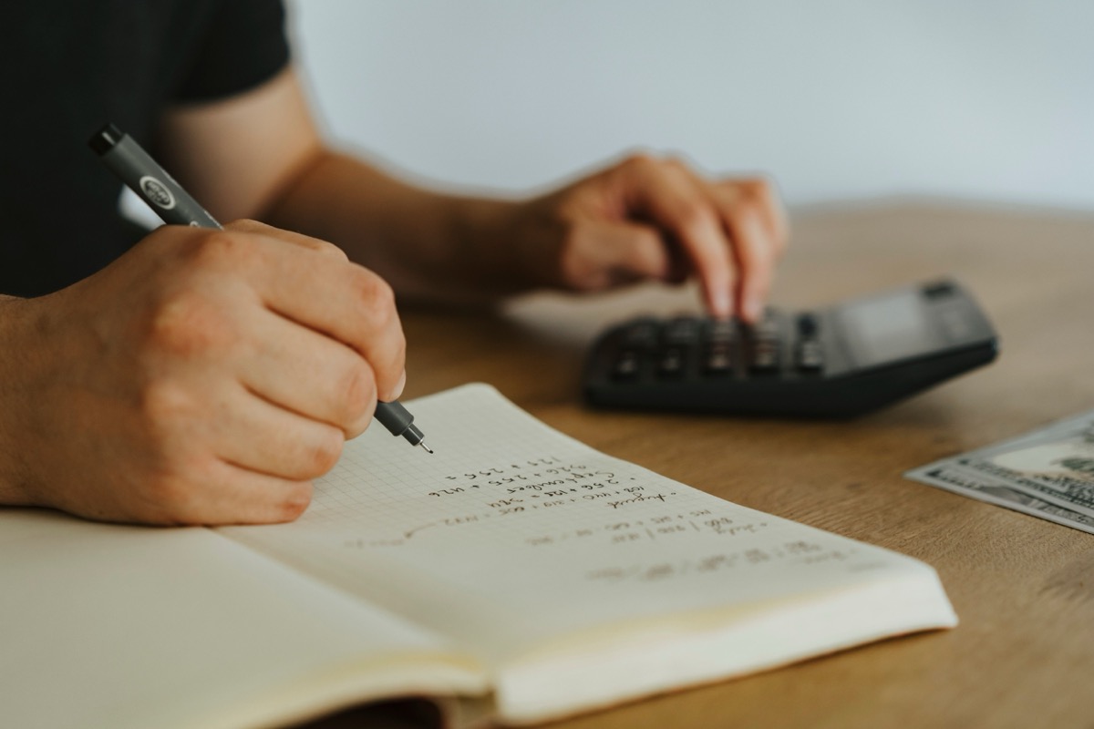 Therapist calculating private practice therapy rates