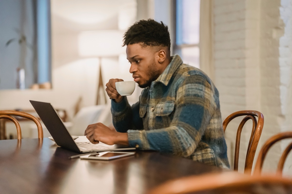 Therapist working on Psychology Today profile on laptop