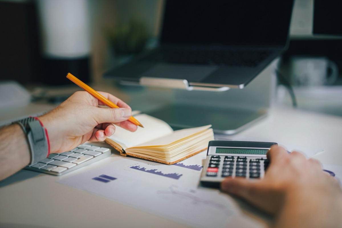Therapist reviewing insurance reimbursement rates and financials